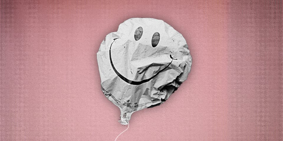 Deflated smiley face balloon